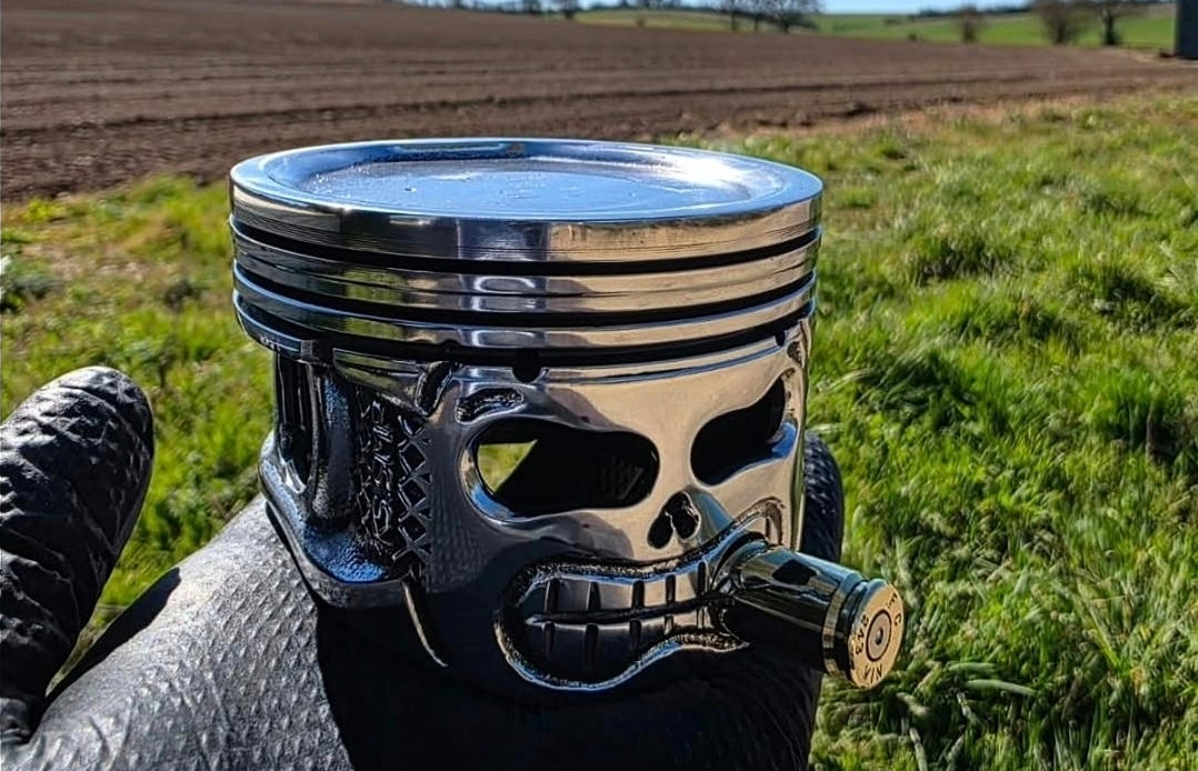 Hand sculpted piston head art