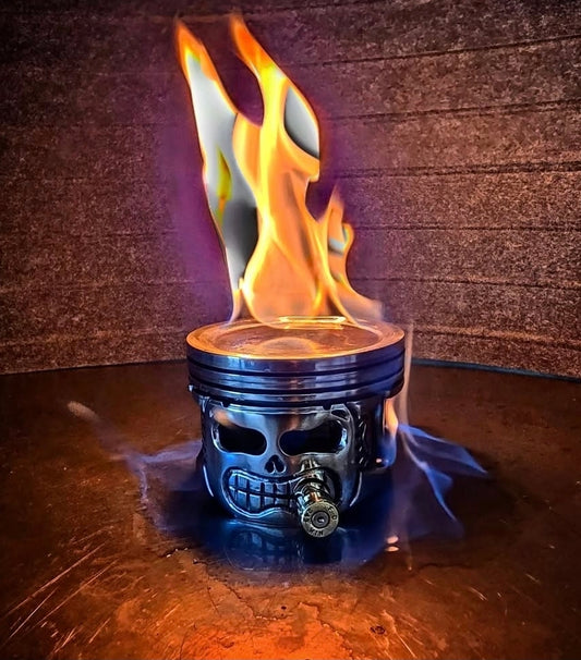 Hand sculpted piston head art